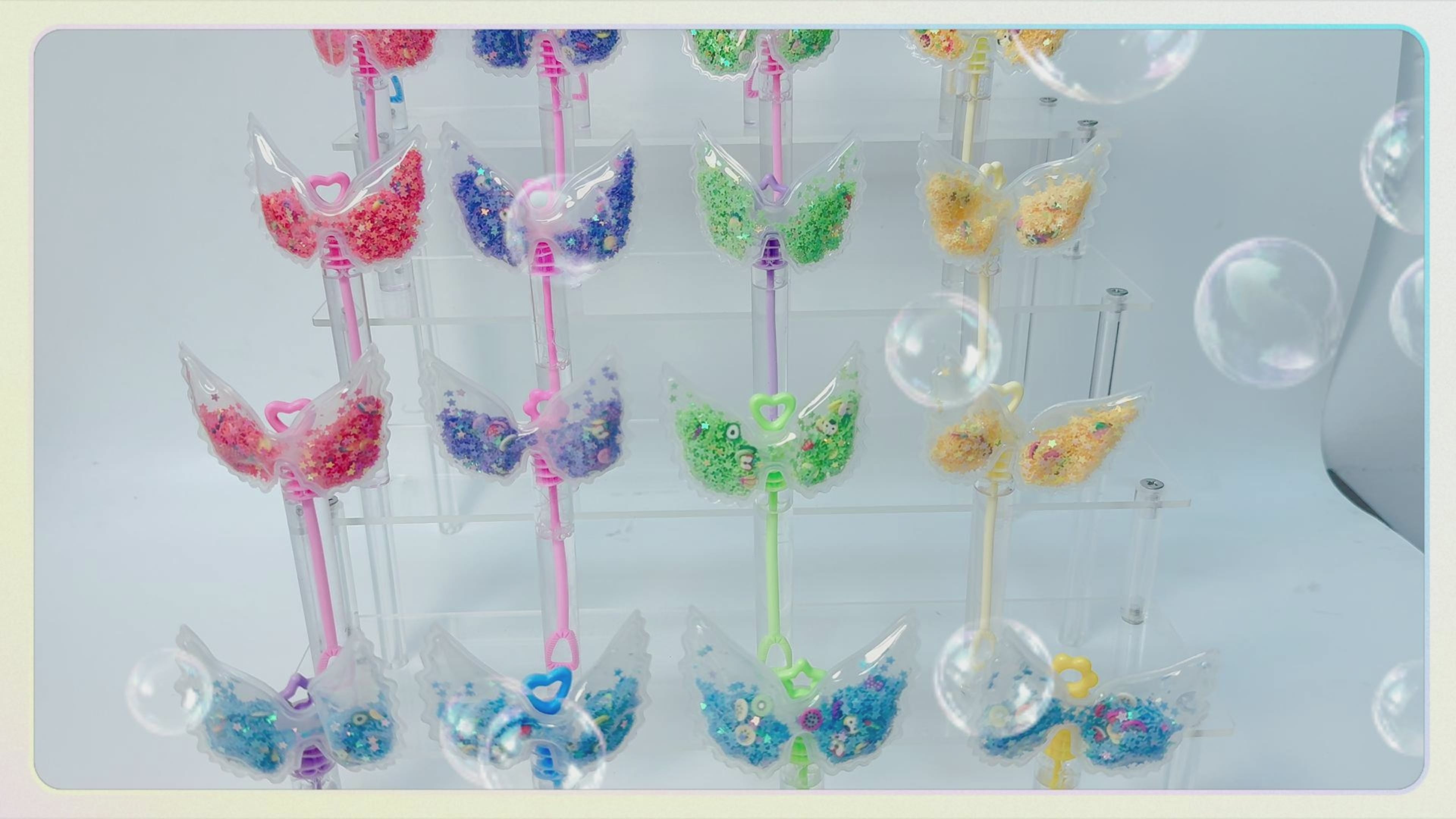 24 Pcs Wing Shaker Bubble Wands, Party Favors, Goodie Bag Fillers | Clear wing shaker toppers with moving glitter add sparkle to goodie bags, pinata fillers, dessert tables, and party setups.